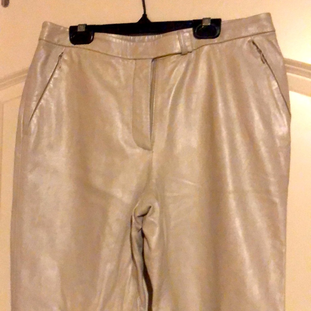 Sz. 8, 100% leather, poly lining, back pocket.